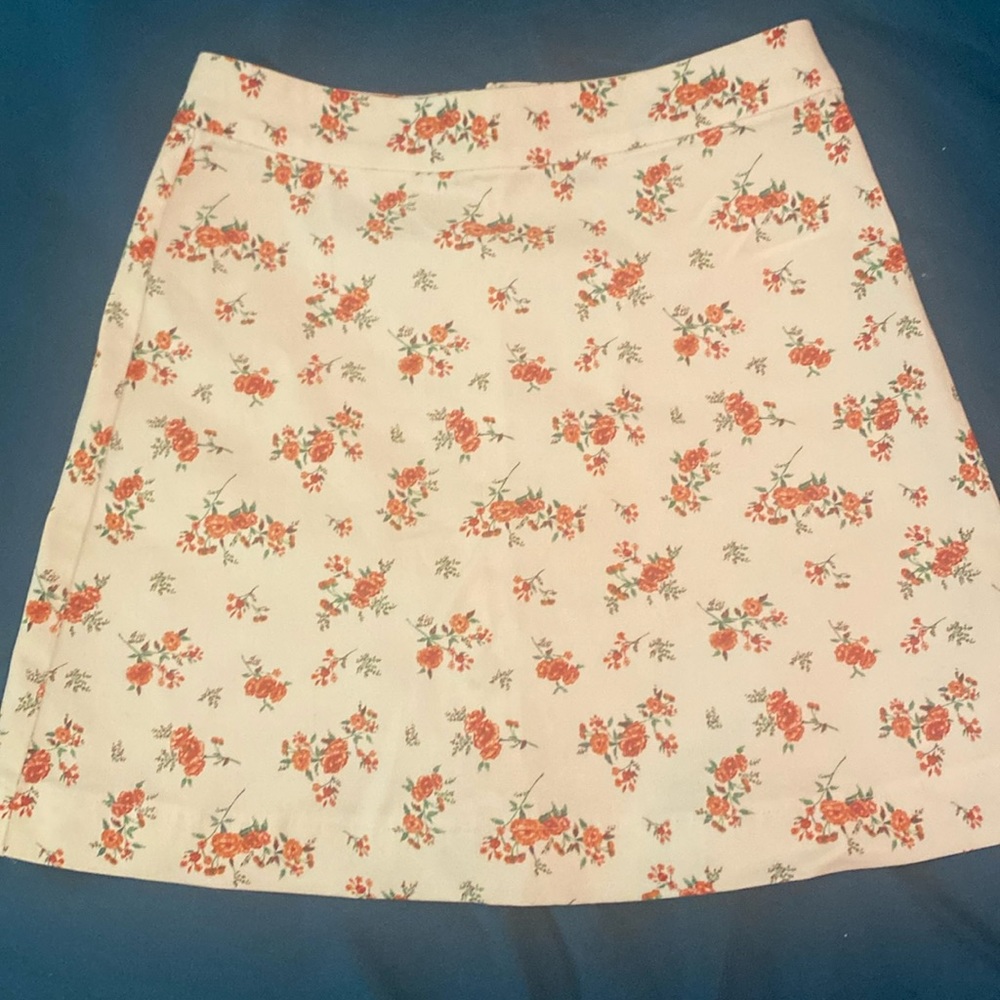 A blue flower skirt and a white rose skirt
